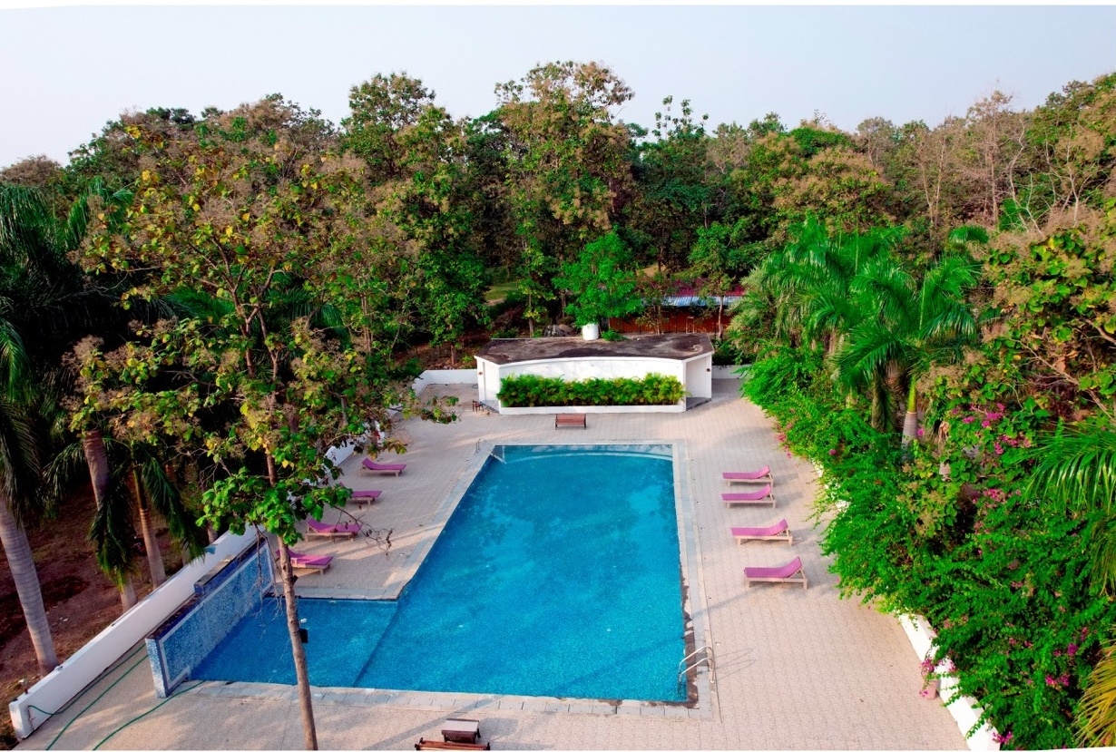 Rosewood Villas Pench aerial view of swimming pool and deck area.
